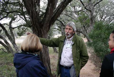 John Ahrns points out the juniper bark